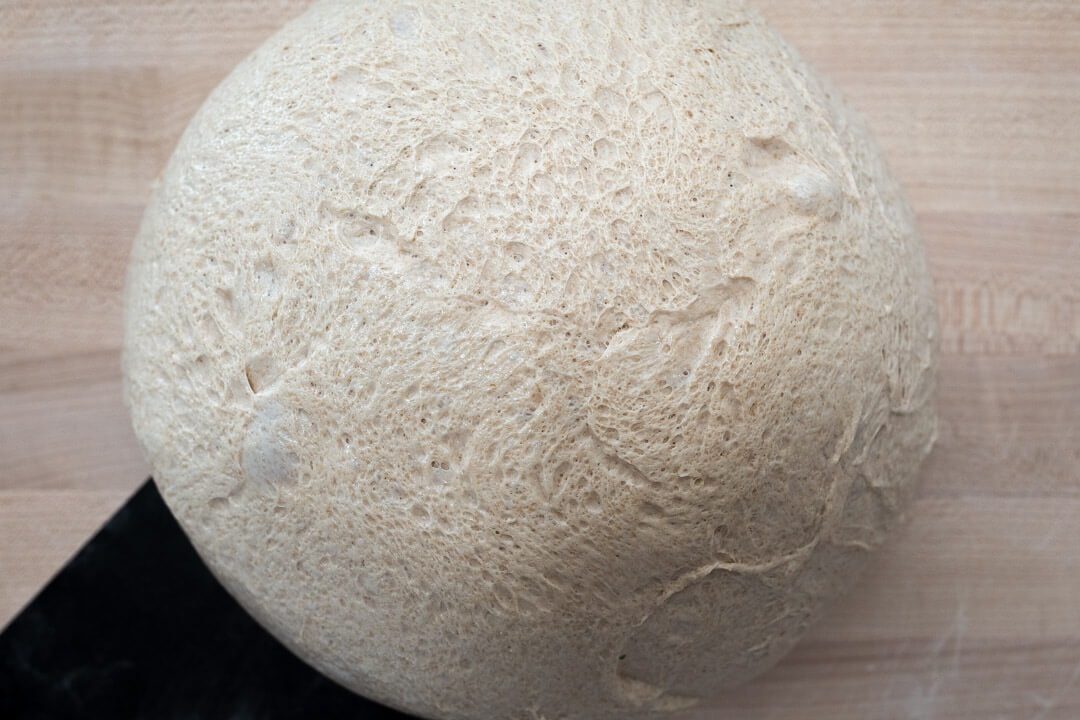 A More Whole Wheat Sourdough Pizza Dough via @theperfectloaf