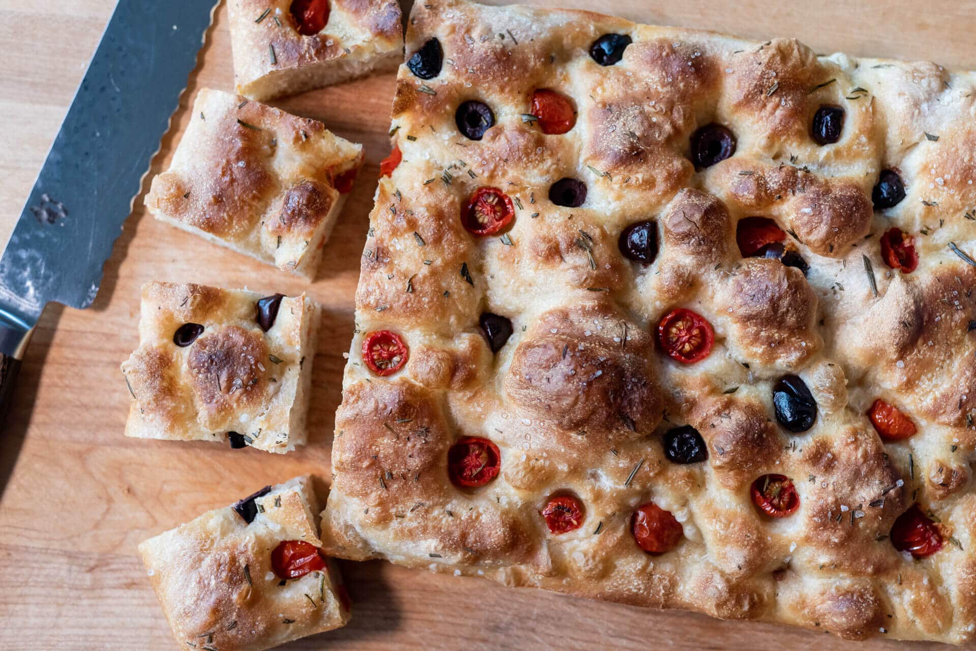 Focaccia with cherry tomatoes and black olives