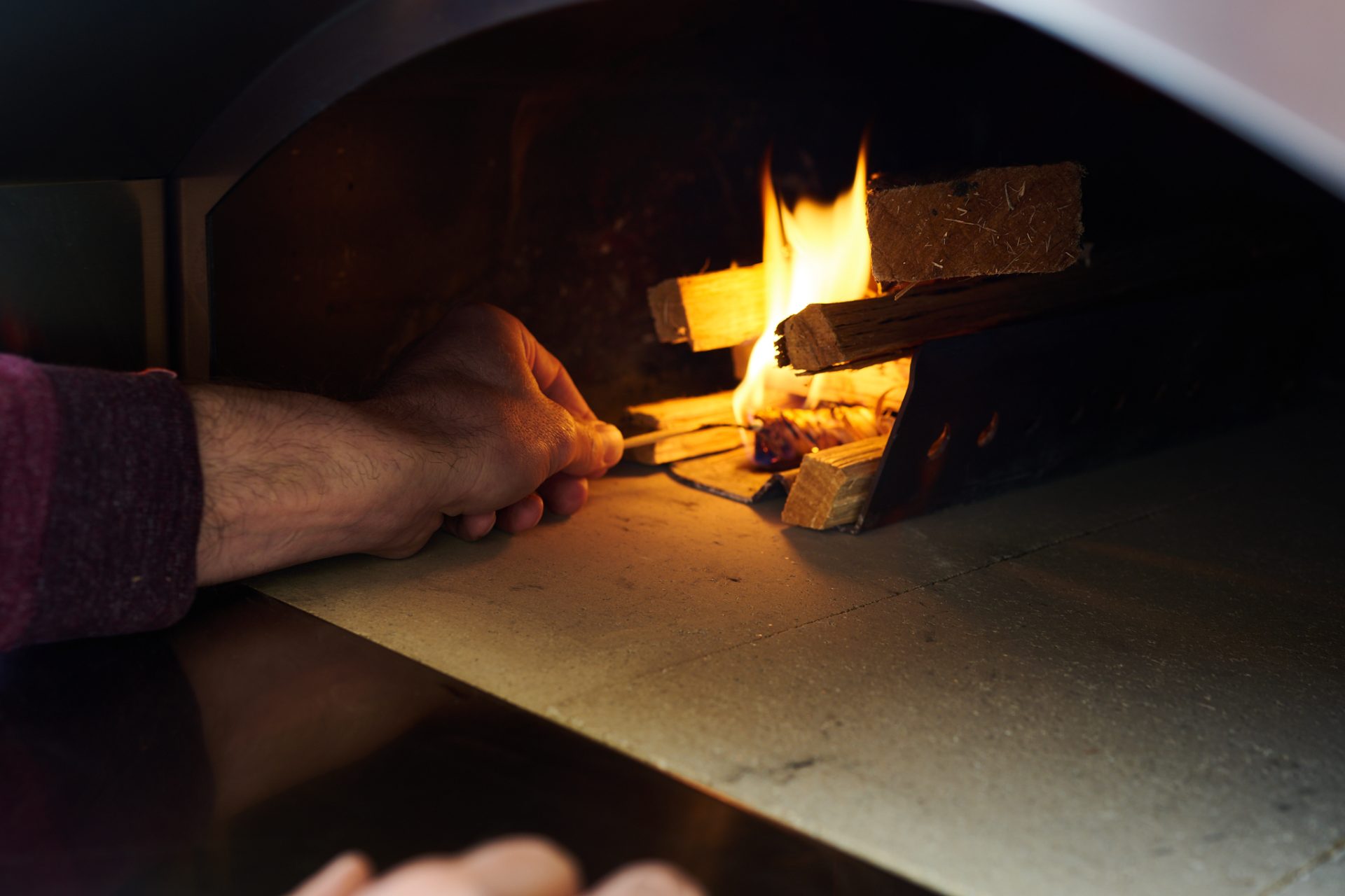 Firing a wood-fired oven